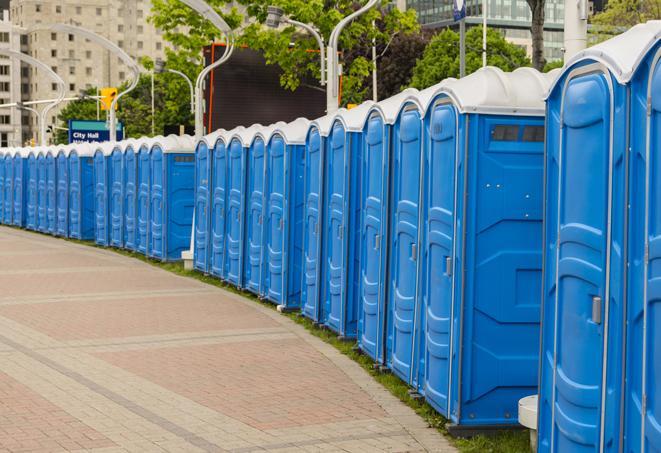 hygienic portable restrooms lined up at a music festival, providing comfort and convenience for attendees in Alameda